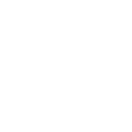 Smiling female dentist in white coat holding dental mirror in clinical office setting.